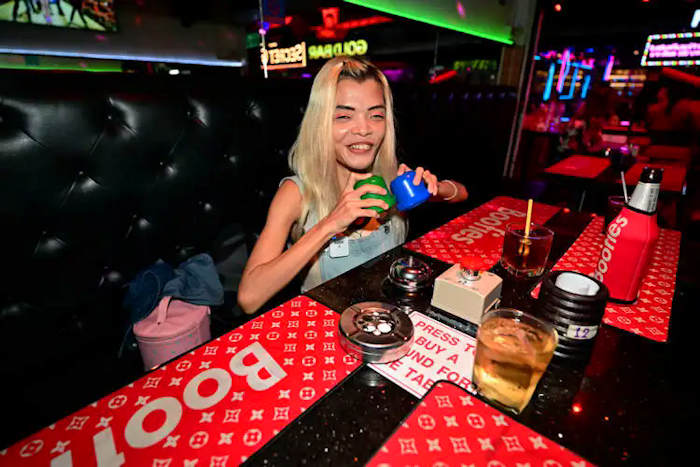 Mali having a beer at Boofies Bar on Soi Six